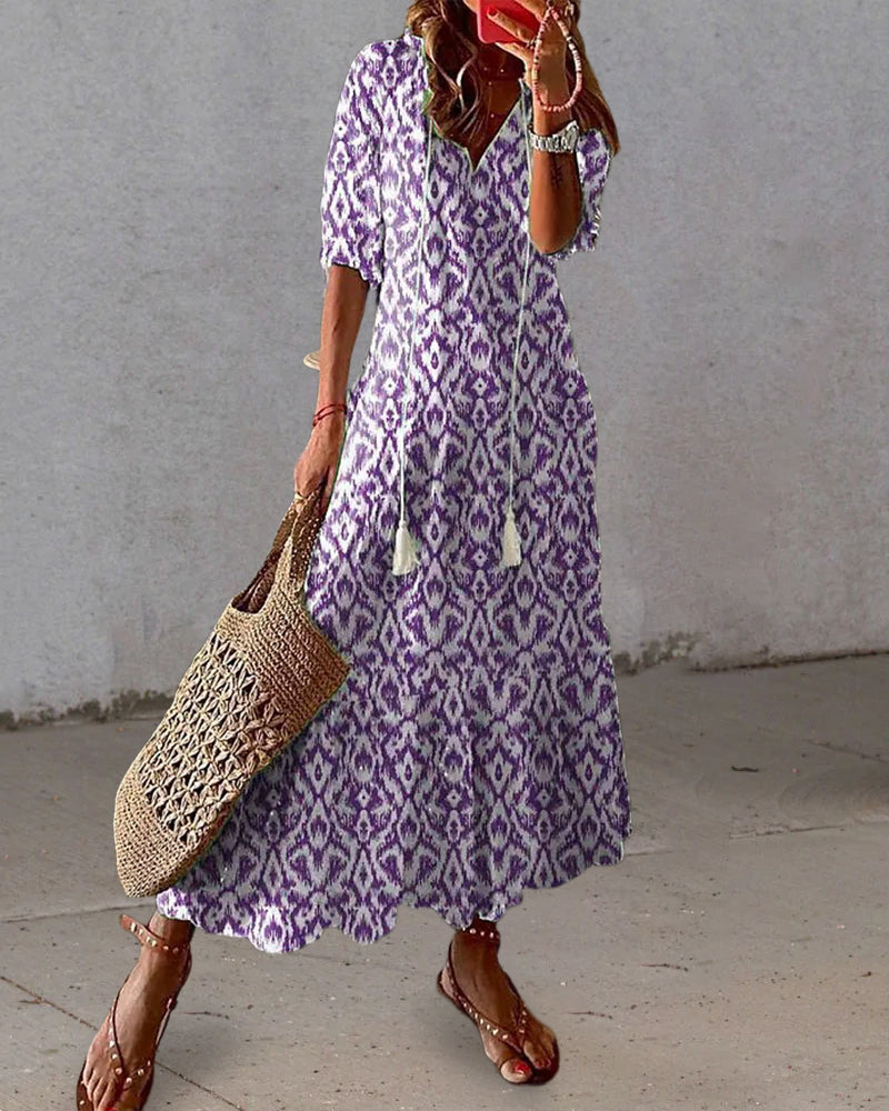 Boho midi dress in purple with white geometric pattern, short sleeves and tiered hem