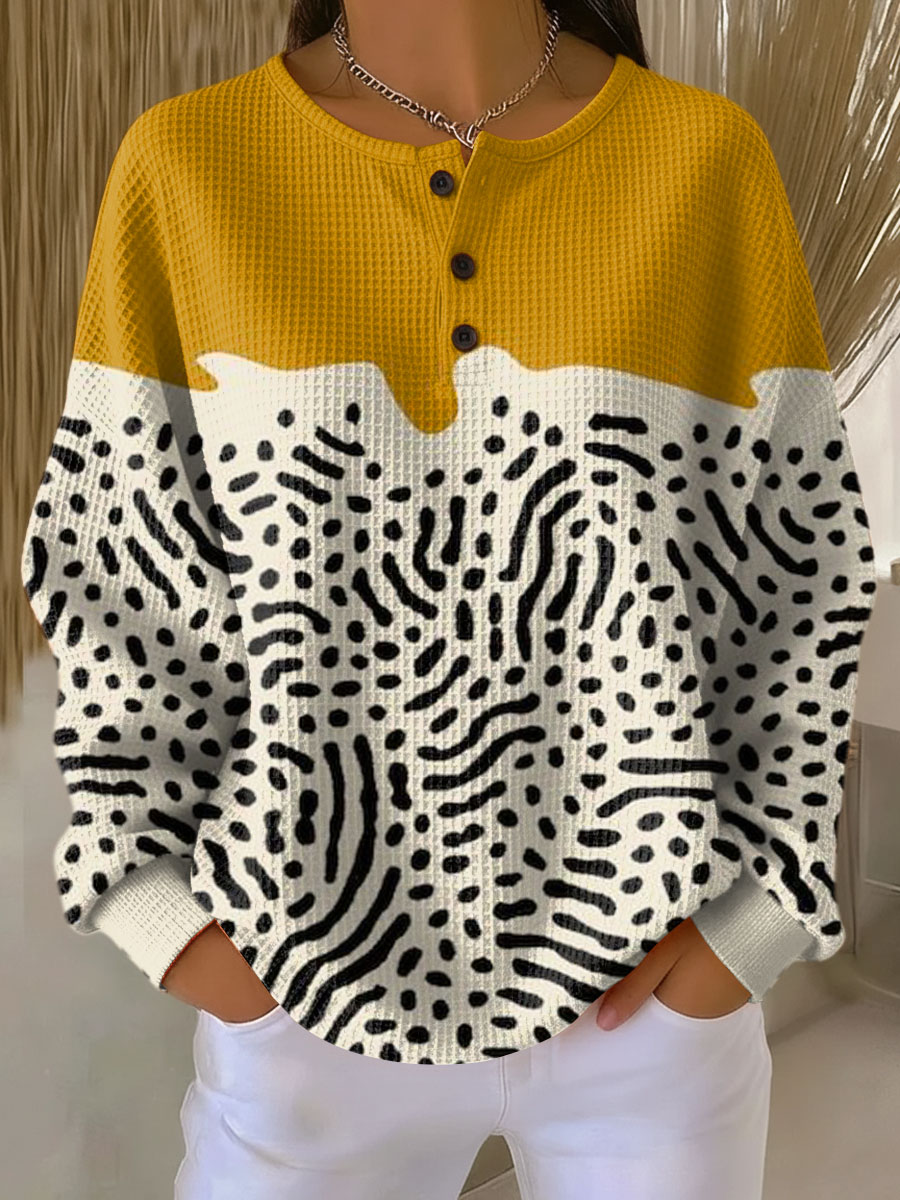 Liv™ knit henley sweater in mustard yellow, cream, with black abstract print