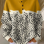 Liv™ knit henley sweater in mustard yellow, cream, with black abstract print