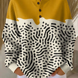 Liv™ knit henley sweater in mustard yellow, cream, with black abstract print