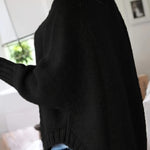 Black cable-knit vintage pullover with turtleneck, long sleeves, ribbed cuffs