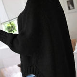 Black cable-knit vintage pullover with turtleneck, long sleeves, ribbed cuffs