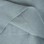 Light blue ribbed knit fabric detail on a fair isle pullover sleeve