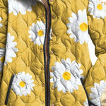 Yellow quilted women’s jacket with large white daisies, button placket and dark trim