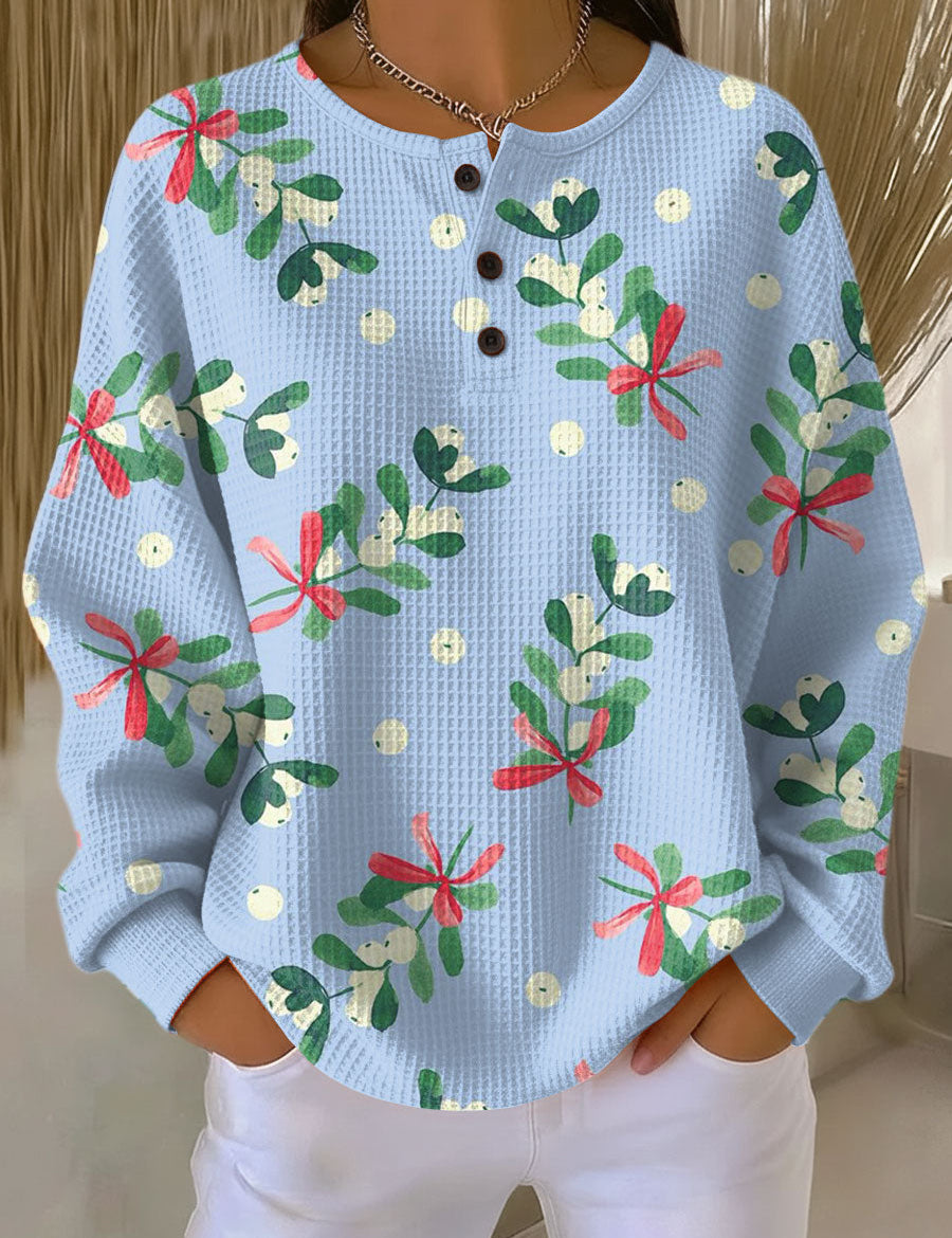 Light blue waffle-knit pullover with Christmas floral print and button placket