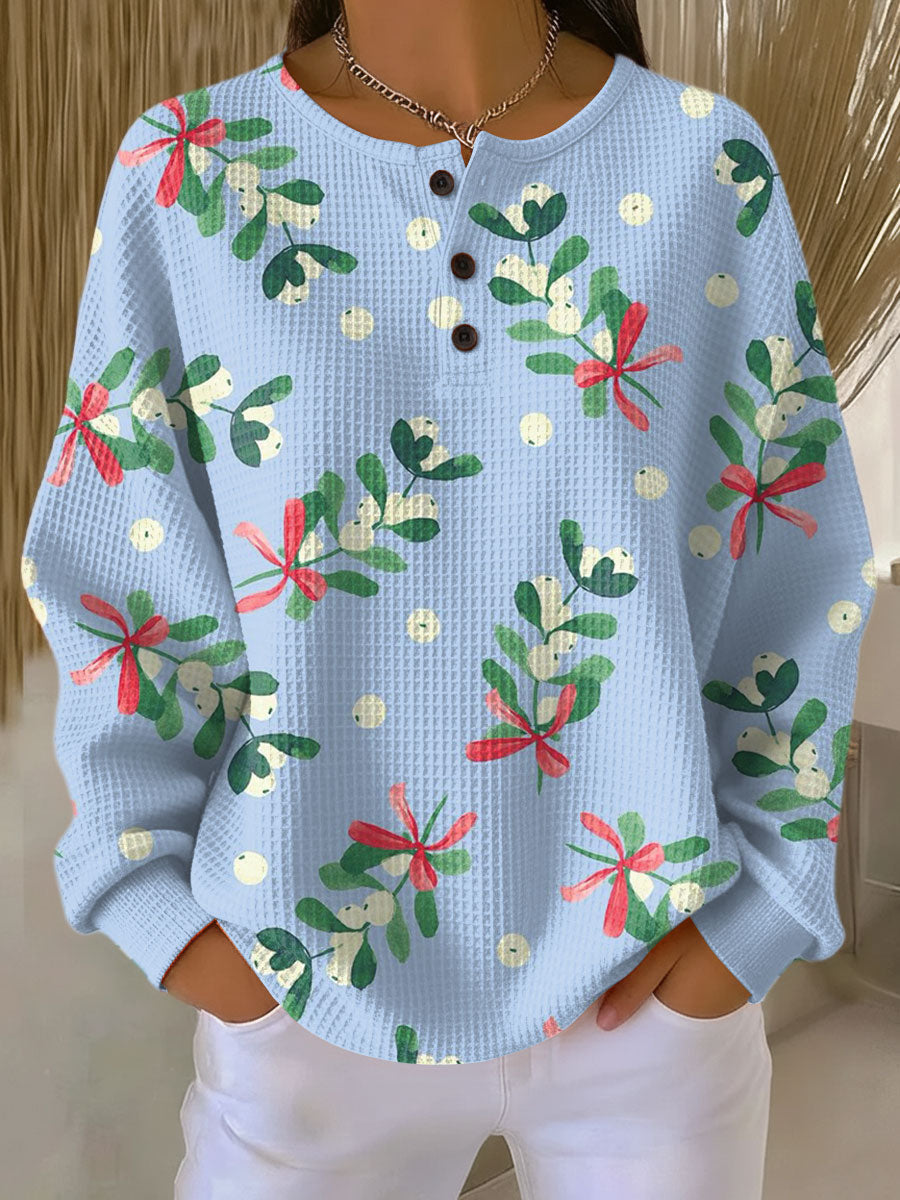 Light blue waffle-knit pullover with Christmas floral print and button placket