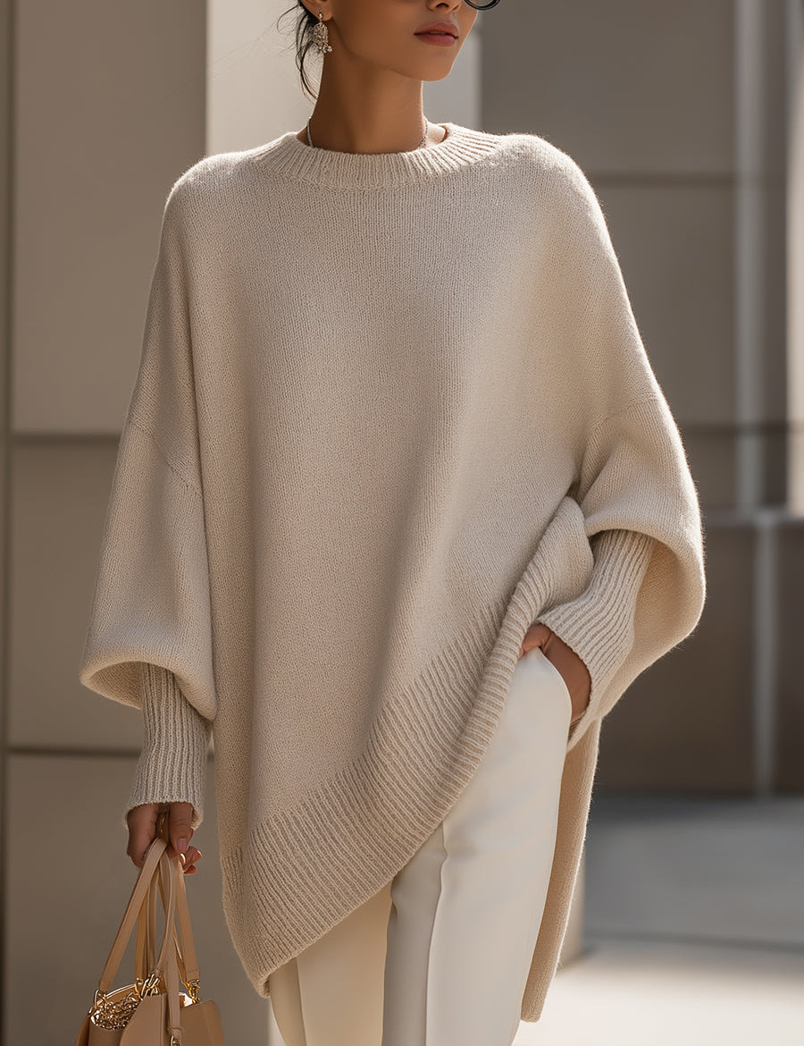 Beige oversized pullover sweater with ribbed crew neck and extended sleeve cuffs