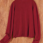 Women’s round-neck cardigan with long sleeves, deep red knit texture, cropped back view