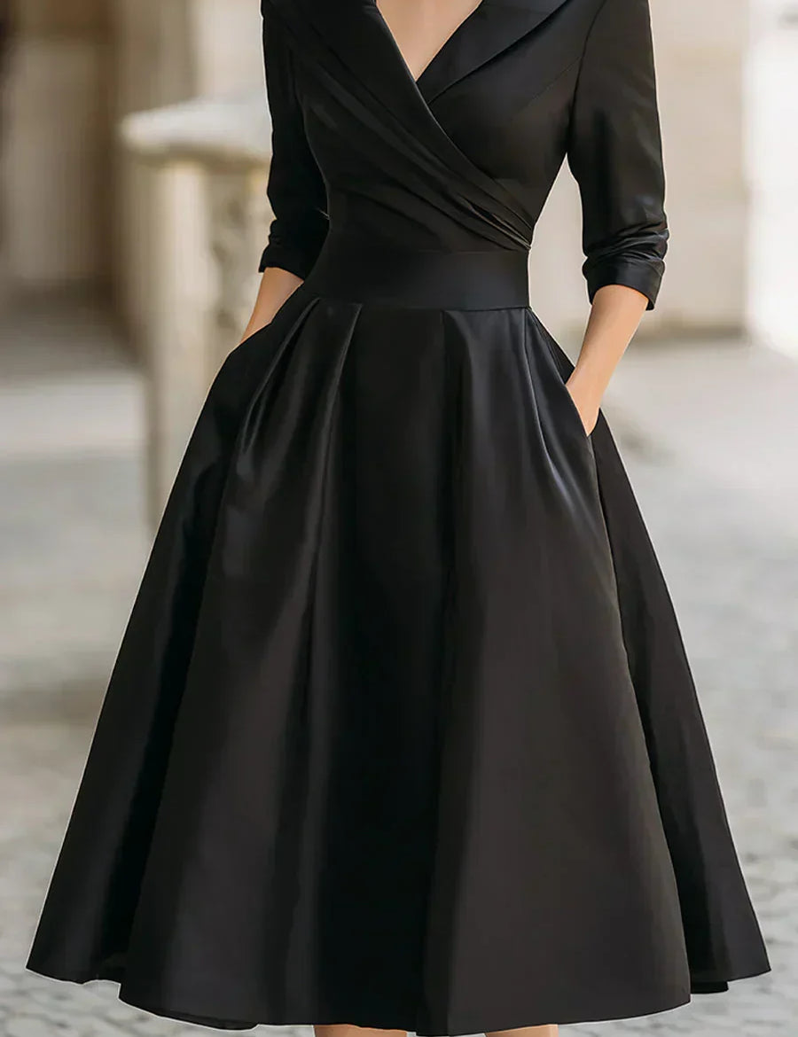 Clara™ elegant black wrap dress with V-neck, 3/4 sleeves, pleated full skirt