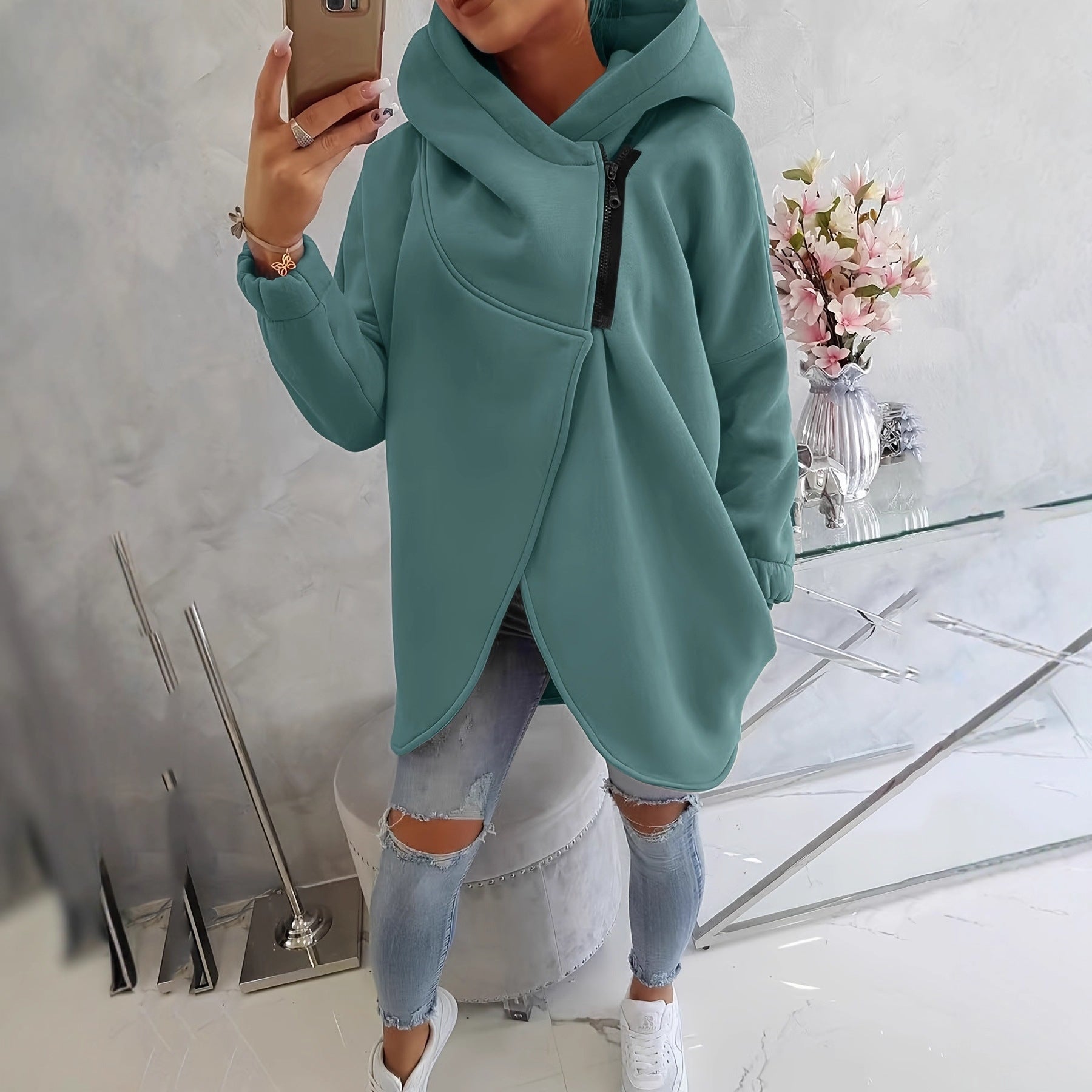 Green zip-up hoodie with hood, front pocket, and black zipper trim