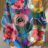 Ida floral pullover sweater with large colorful flowers, crew neck and button placket
