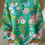 Green pullover with colorful ethnic floral pattern and four-button placket