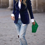 Blue velvet blazer with notch lapels, single-breasted front, gold buttons, flap pockets