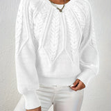 White cable-knit long-sleeve pullover with half-zip neckline and ribbed cuffs