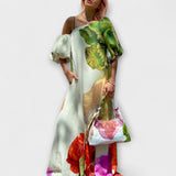 Skylar - Maxikleid mit floralem Muster, asymmetrischem Ausschnitt und Ballonärmeln