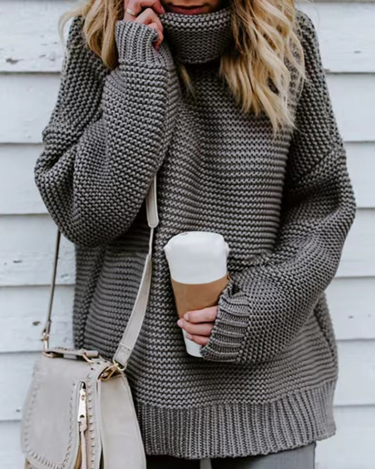 Grey roll-neck knitted sweater with long sleeves and ribbed hem and cuffs.