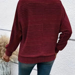 Burgundy striped knit pullover with batwing sleeves, ribbed cuffs and hem