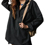 Black oversized denim pullover with half-zip neckline and chest pocket