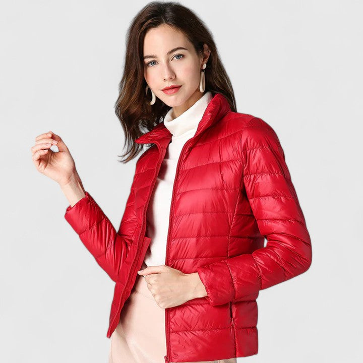 Elegant quilted zip-up puffer jacket in red with stand collar and long sleeves