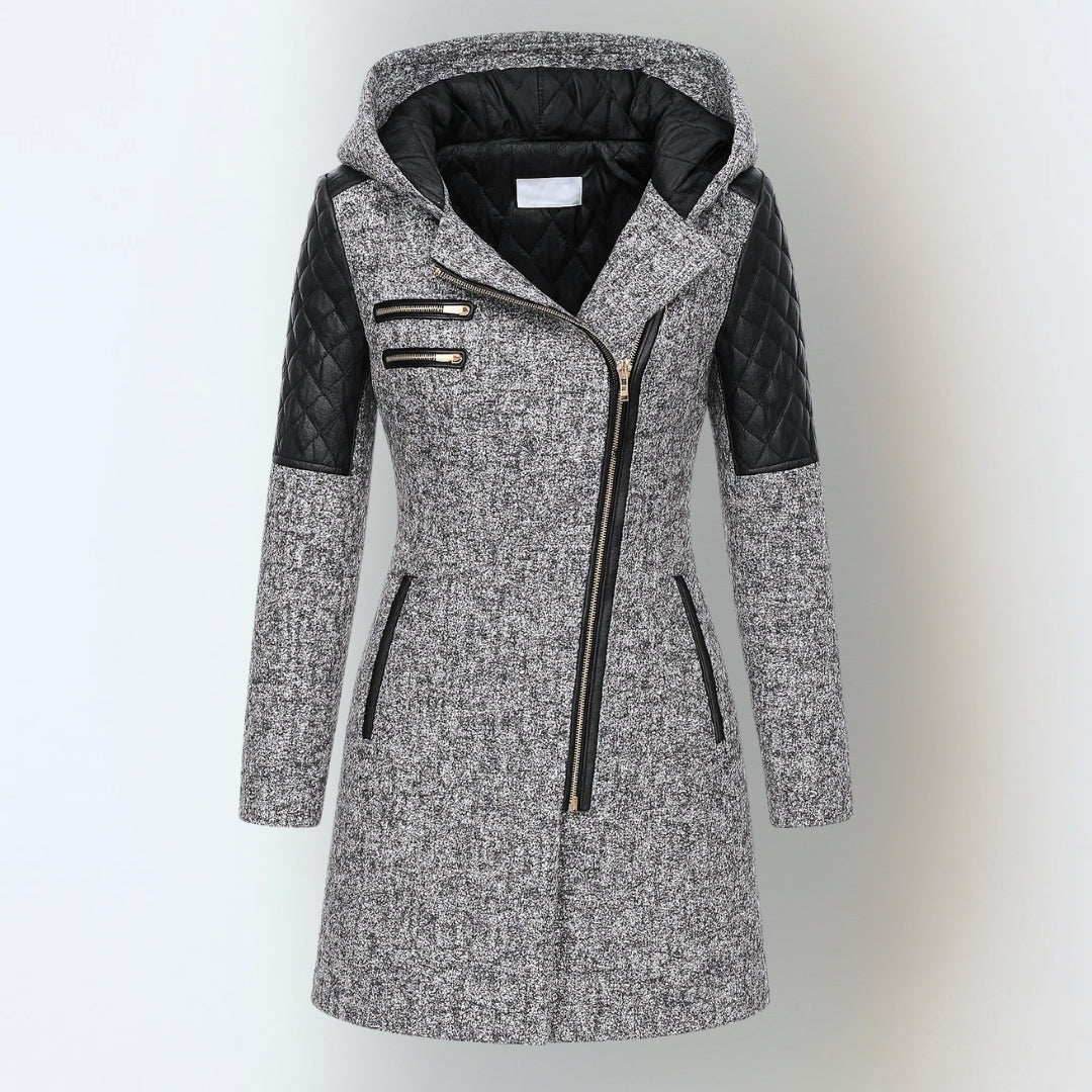 Women’s winter parka coat in light gray with black quilted sleeves, zip front, hood.