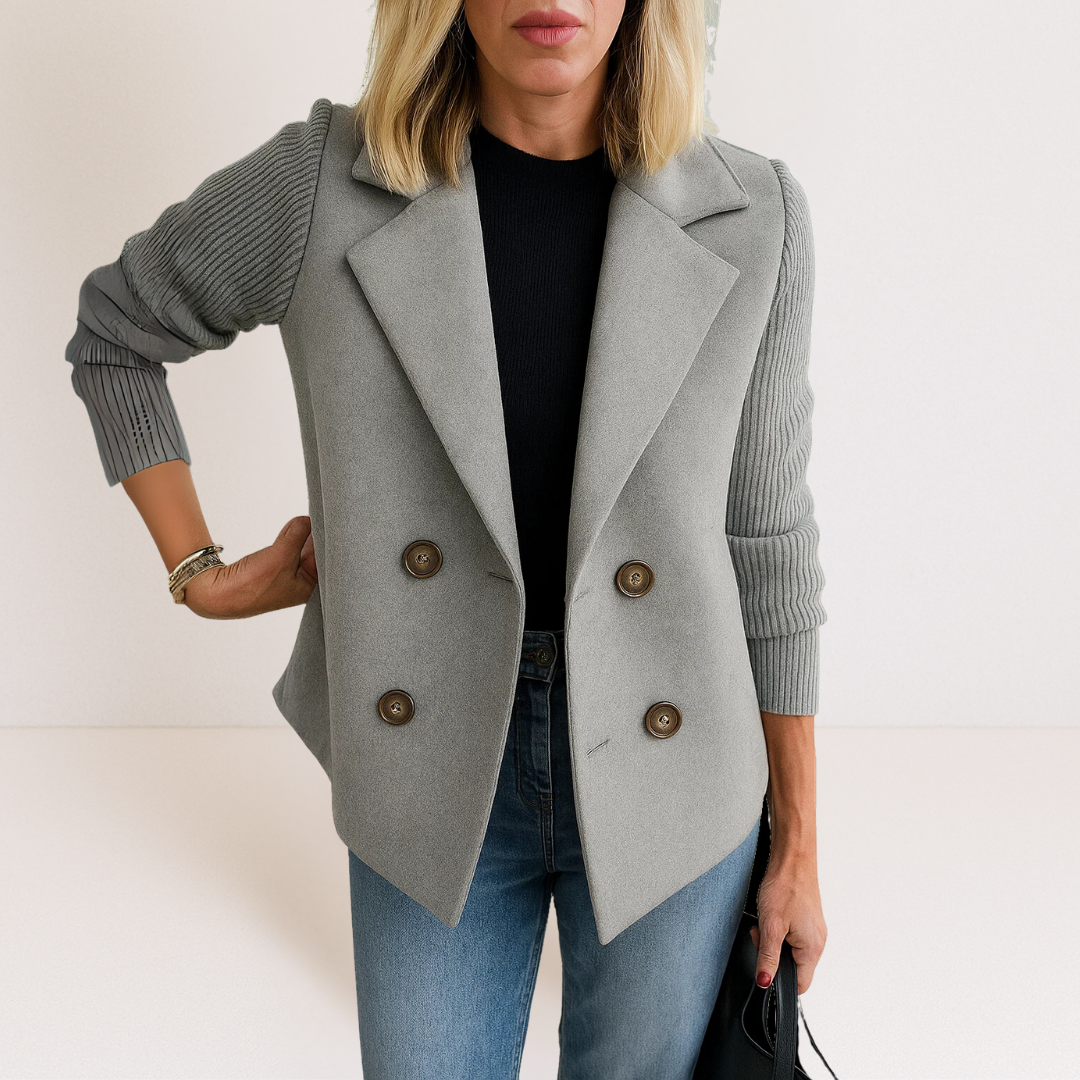 Gray everyday blazer with notch lapels, four-button front, and ribbed knit sleeves