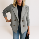 Gray everyday blazer with notch lapels, four-button front, and ribbed knit sleeves