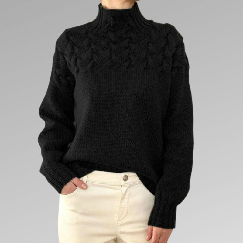 Women's cable-knit turtleneck sweater, black with textured front detail.