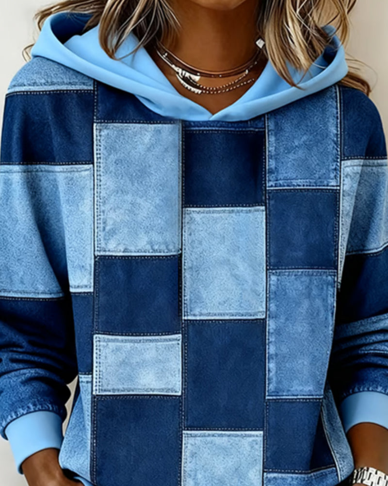 Blue patchwork hoodie close-up, hood with drawstring and front square blocks