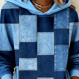 Blue patchwork hoodie close-up, hood with drawstring and front square blocks