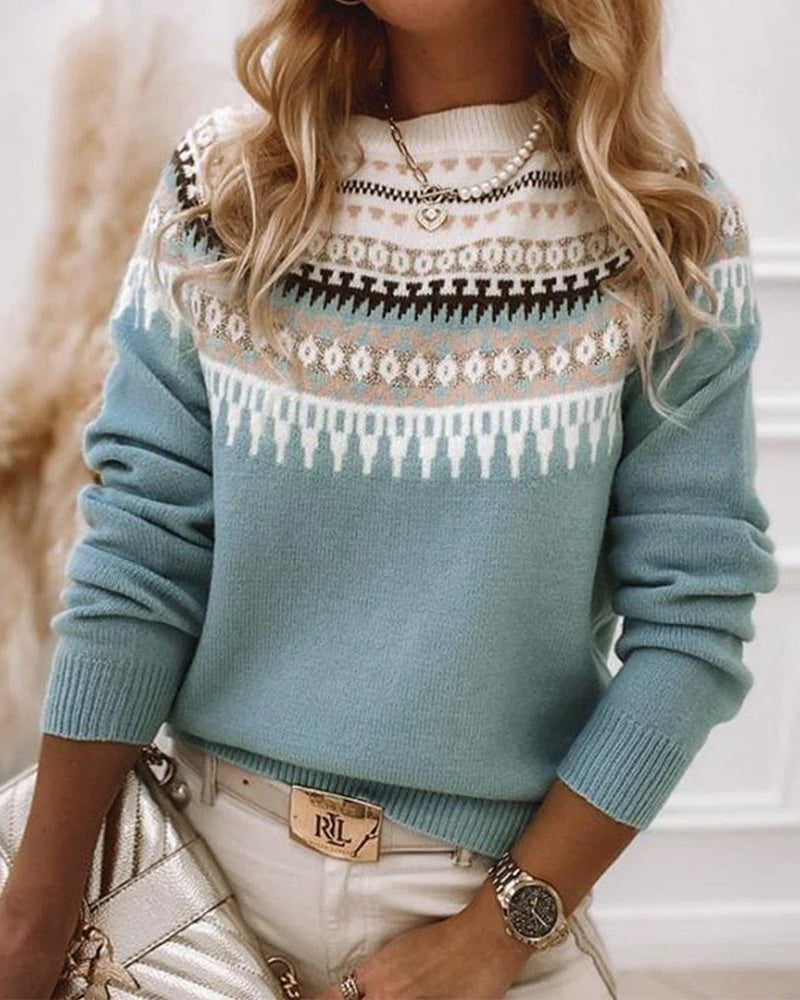 Light blue knit pullover with fair isle yoke, crew neck and long sleeves