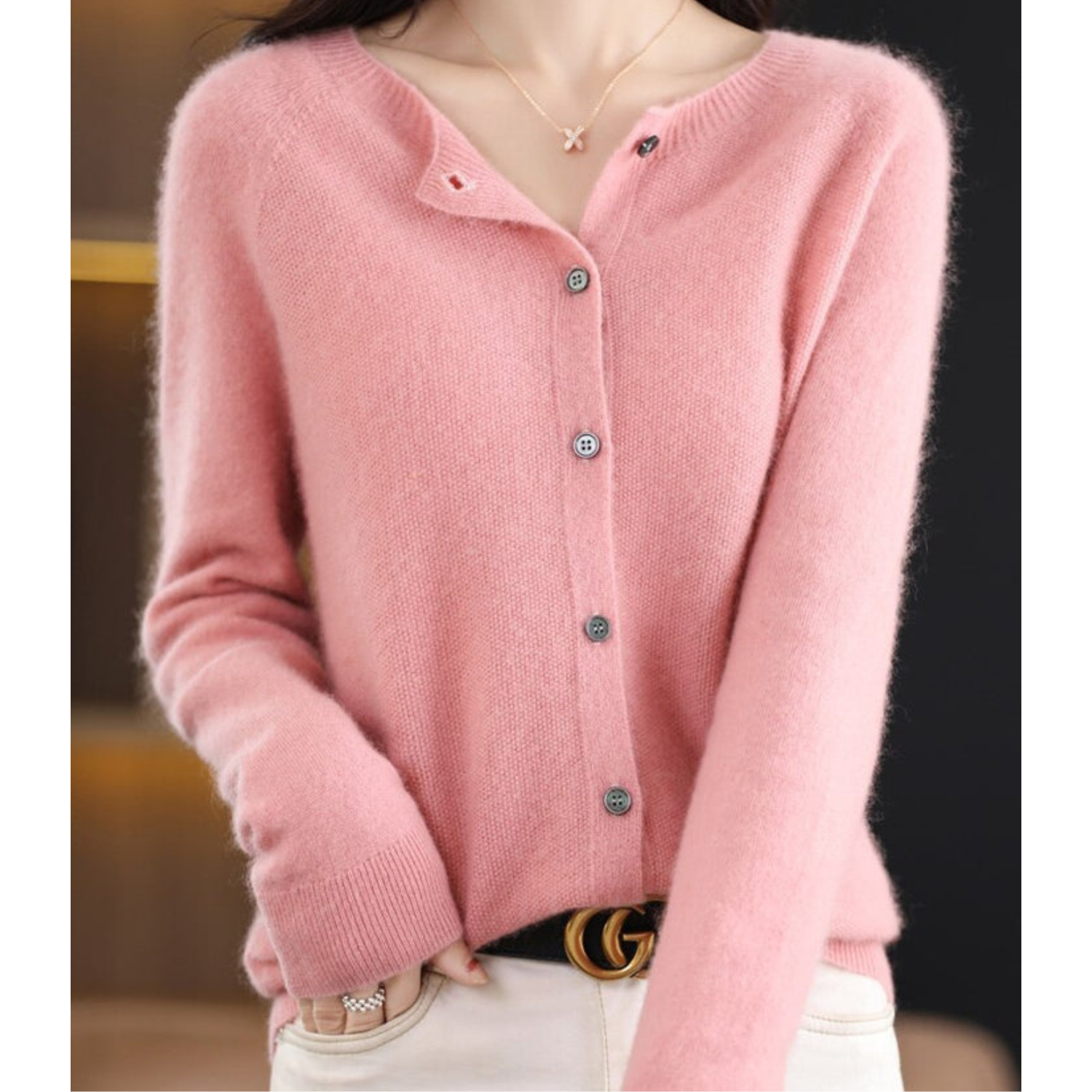 Light pink button-front knit pullover with long sleeves and ribbed trim