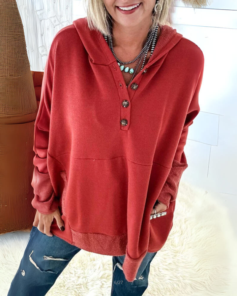 Women’s ruby-red hooded pullover sweater with button placket and kangaroo pocket