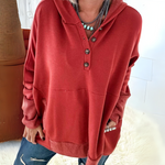 Women’s ruby-red hooded pullover sweater with button placket and kangaroo pocket