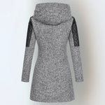 Women’s winter parka coat in light gray, back view, quilted sleeves, attached hood.