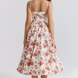 Women's white floral slimming dress with racer back and gathered flared midi skirt
