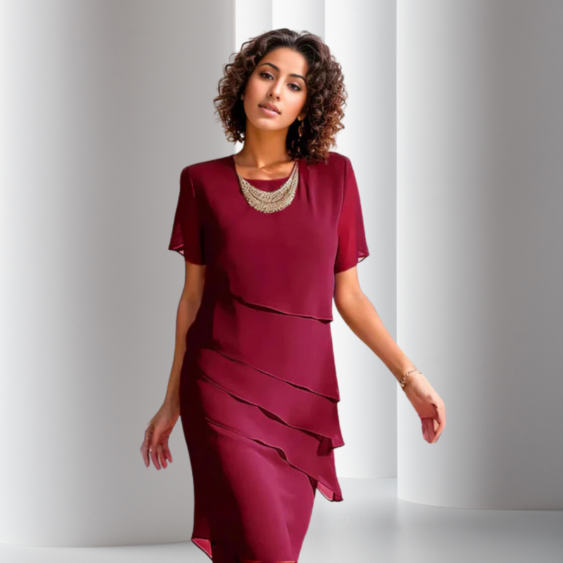 Red layered chiffon dress with short sleeves and draped tiered front