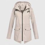 Cream hooded zip-up jacket with drawstring, front pockets, and buttoned flap closures