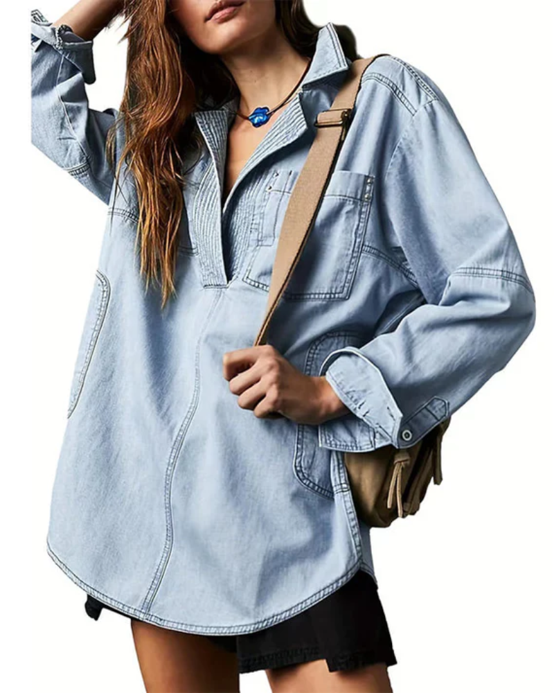 Light blue oversized denim pullover with half-zip collar and front patch pockets