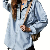 Light blue oversized denim pullover with half-zip collar and front patch pockets