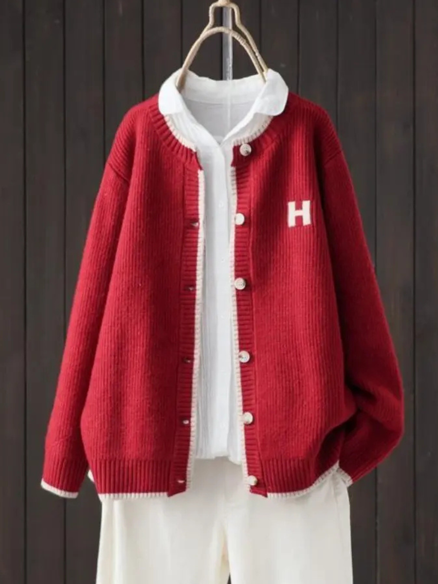 Red classic cardigan with button front, ribbed trim, and 'H' patch