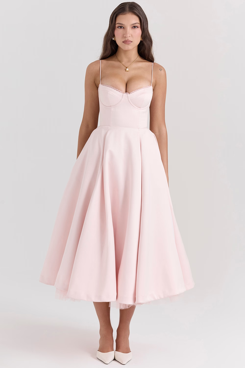 Blush pink fitted corset-style slimming dress with spaghetti straps and full midi skirt
