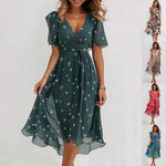 Knee-length dark green wrap dress with short sleeves, small white print, tied waist