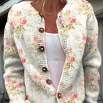 Cream knit button cardigan with pink floral print and green leaf details, V-neck