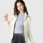 Elegant quilted zip-up puffer jacket in cream with stand collar and long sleeves