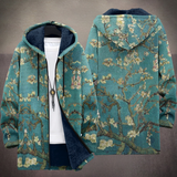 Vibrant patterned hooded cardigan, back view, teal and tan knit with dark hood lining