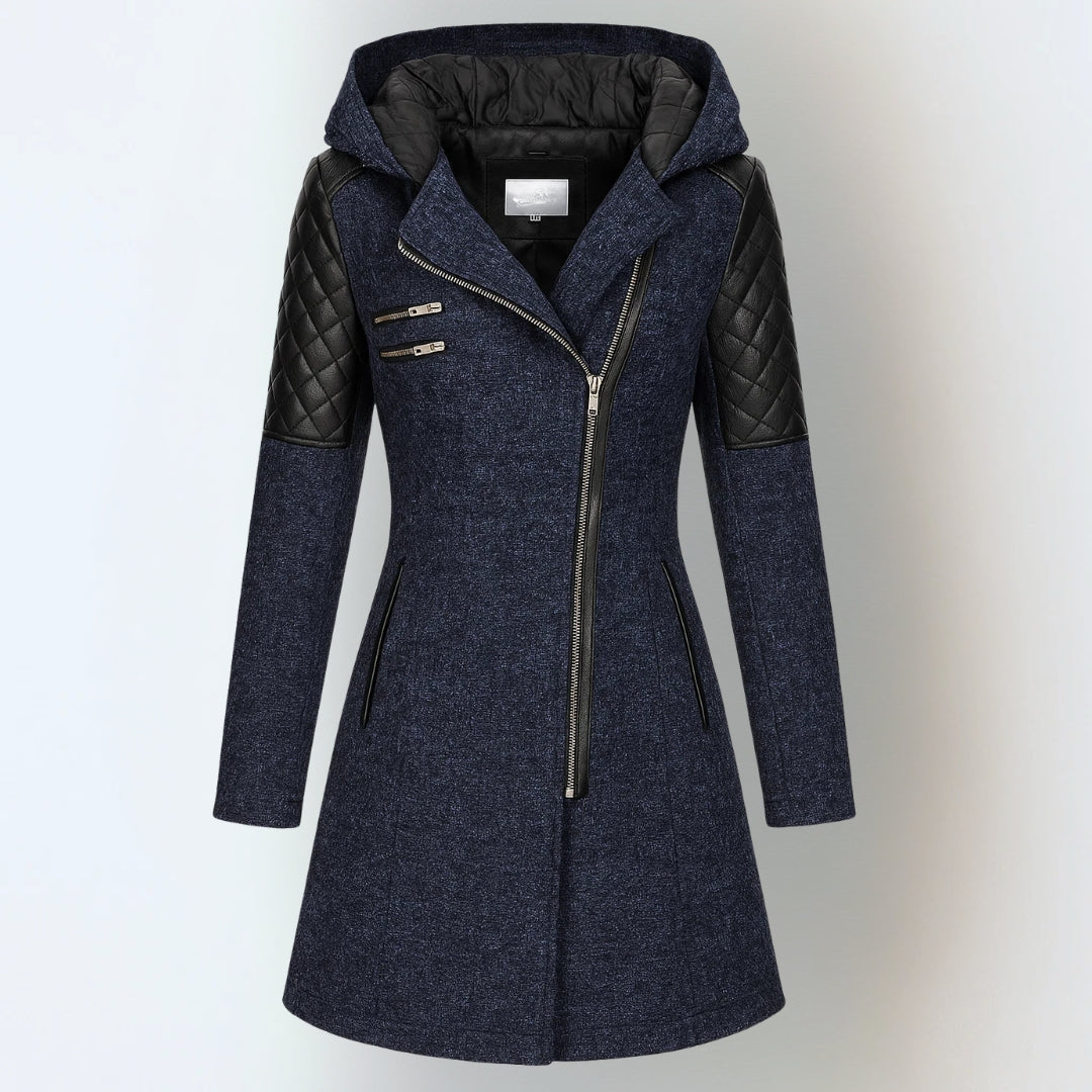Women’s winter parka coat in navy blue with black quilted sleeves, zip front, hood.