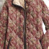 Women's vintage floral jacket close-up, maroon patterned fabric with gold buttons and collar