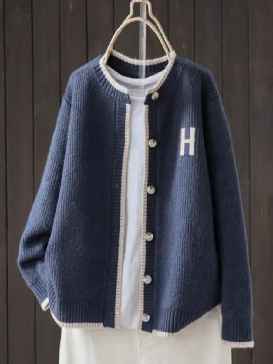 Navy classic cardigan with button front, ribbed trim, and 'H' patch