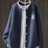 Navy classic cardigan with button front, ribbed trim, and 'H' patch