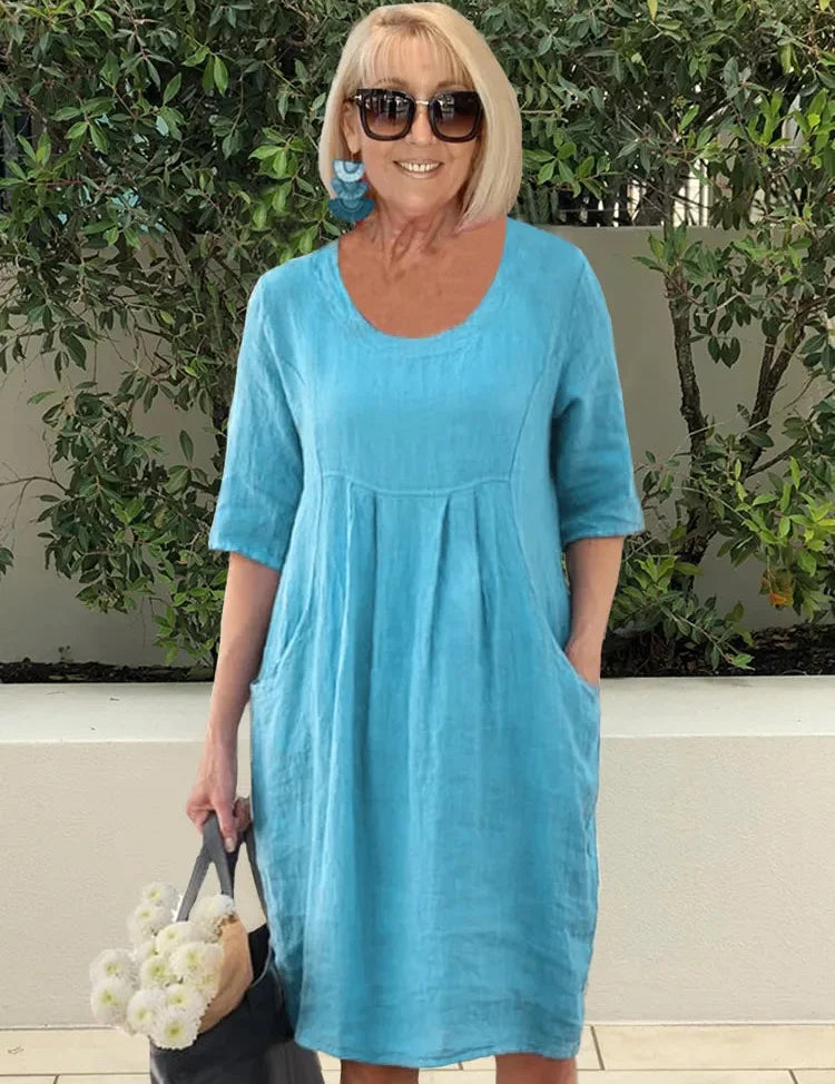 Turquoise A-line summer dress with round neckline and short sleeves